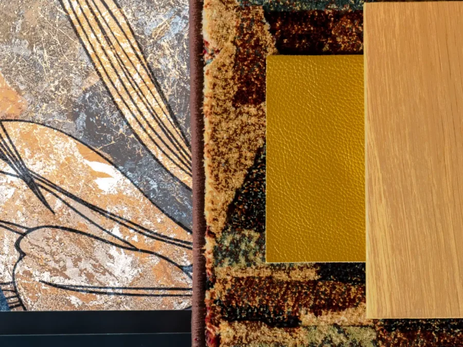 Tappeto patchwork multicolore con campioni di finiture dorate